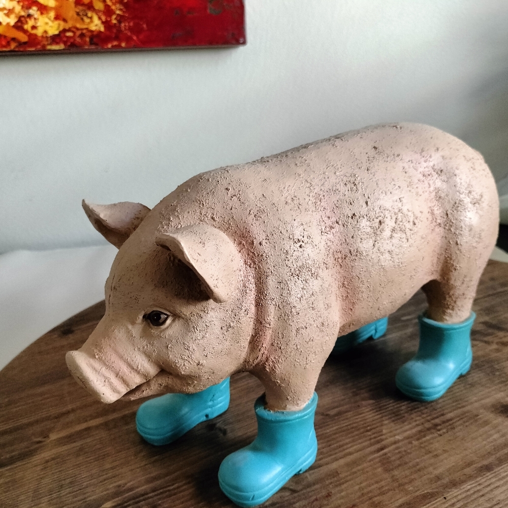 Cute pink heavy resin pig measures 14 in x 7 in blue boots